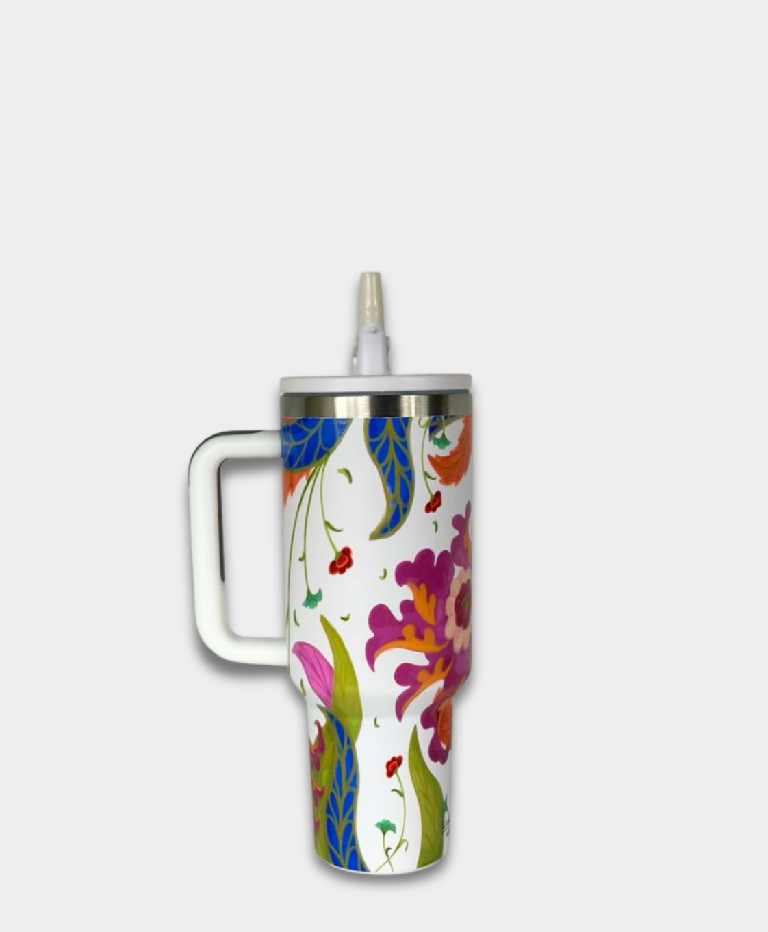 Floral travel mug with handle, bright multicolor design, on white background, La Casona Edit